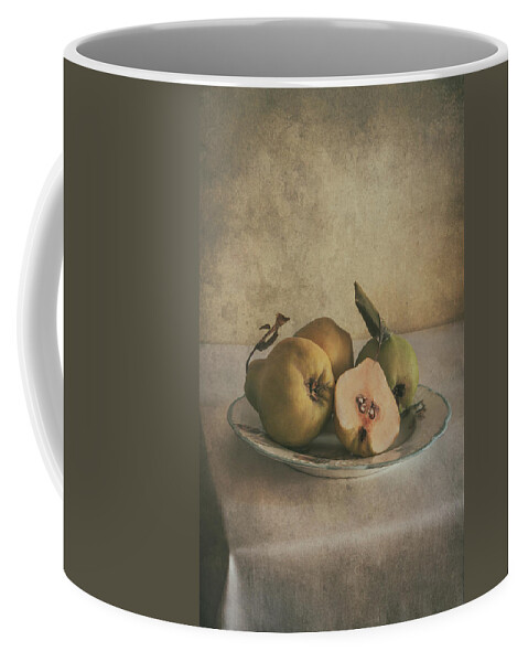 Still Life Coffee Mug featuring the photograph Plate of fresh quince by Jaroslaw Blaminsky