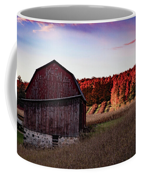 Michigan Fall Coffee Mug featuring the photograph Red barn at sunrise with fall colors in northern Michigan by Eldon McGraw