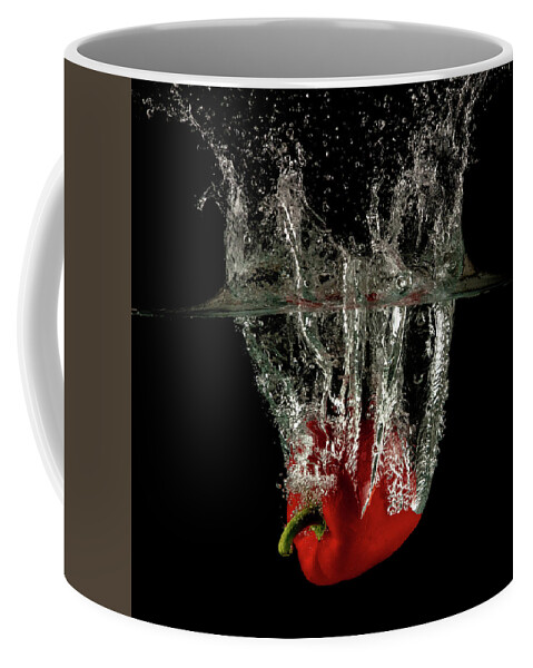 Pepper Coffee Mug featuring the photograph Red bell pepper dropped and slashing on water by Michalakis Ppalis