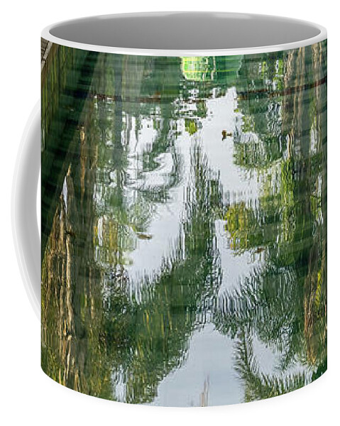 Conical Fountain Coffee Mug featuring the photograph Reflecting on Palms - Cool Conical Fountain in Parque das Nacoes Lisbon Portugal by Georgia Mizuleva