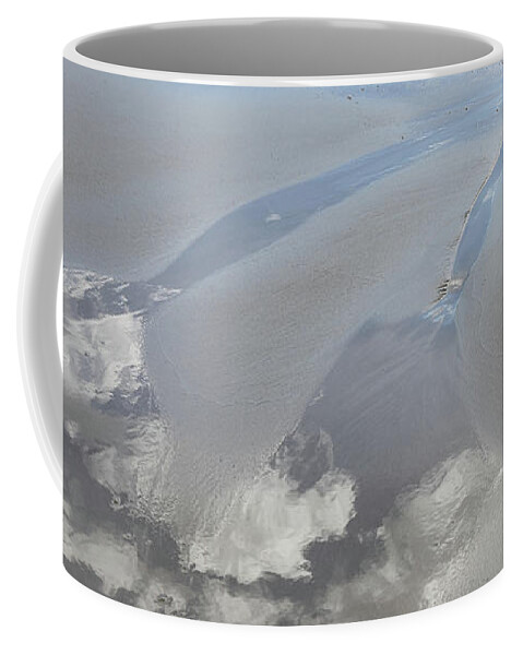 Sandy Beach Coffee Mug featuring the photograph Reflection of the clouds in the wet sand by Adriana Mueller
