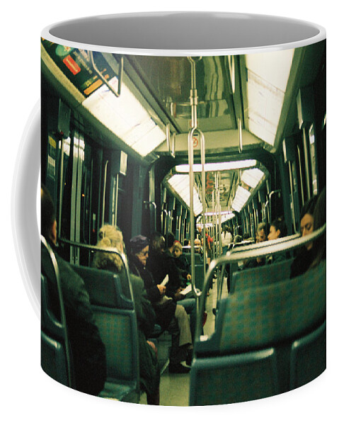Metro Coffee Mug featuring the photograph Regular commute in the parisian metro by Barthelemy De Mazenod
