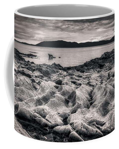 Monochrome Coffee Mug featuring the photograph Rocky dune beach by Bradley Morris