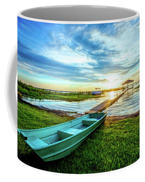 Docks Coffee Mug featuring the photograph Rowboat at the Water's Edge by Debra and Dave Vanderlaan