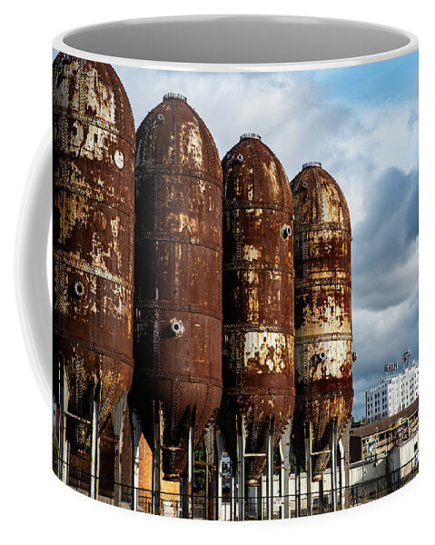 Rusty Tanks And White Herald Building Coffee Mug featuring the photograph Rusty Tanks and White Herald Building by Tom Cochran