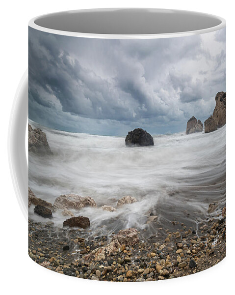 Seascape Coffee Mug featuring the photograph Seascape with windy waves during storm weather at the a rocky co by Michalakis Ppalis
