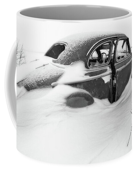1947 Coffee Mug featuring the photograph Snow Cruiser - 1947 Chevy Coup in a ND snow scene - black and white conversion by Peter Herman