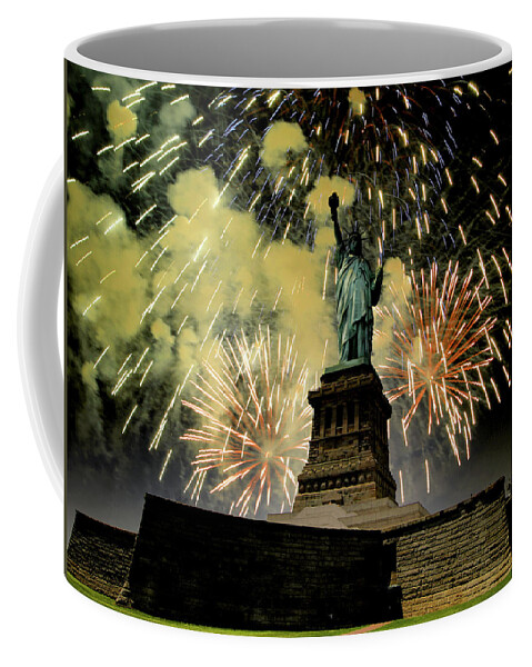 Statue Of Liberty Coffee Mug featuring the photograph Statue of Liberty with fire works by Montez Kerr