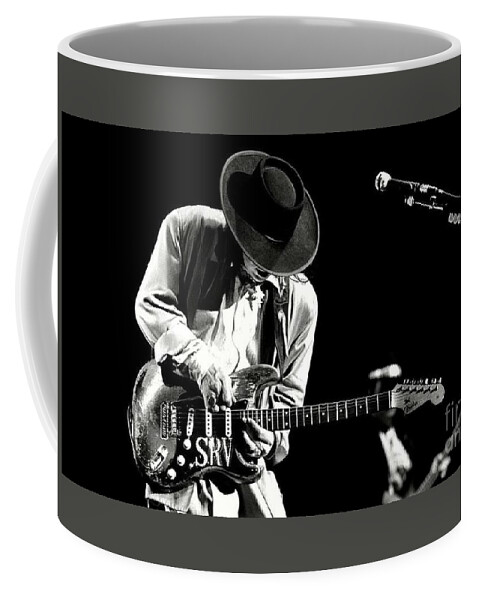 Stevie Ray Vaughan Coffee Mug featuring the photograph Stevie Ray Vaughan in concert by Action