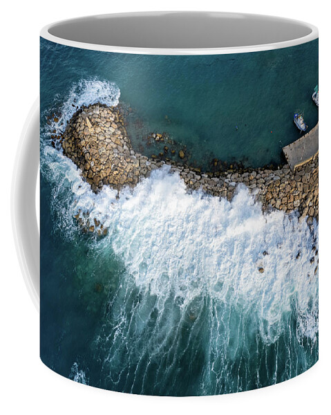 Brakewater Coffee Mug featuring the photograph Stormy windy waves on the shore. Drone photography. by Michalakis Ppalis