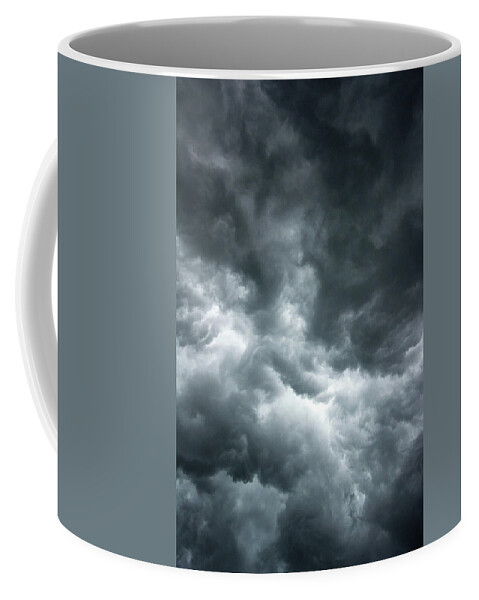 Clouds Coffee Mug featuring the photograph Stormy clouds in the sky. by Bernhard Schaffer