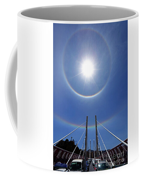 Spectacular Sky Coffee Mug featuring the photograph Sun halos above Puente Gemelo La Paz Bolivia by James Brunker