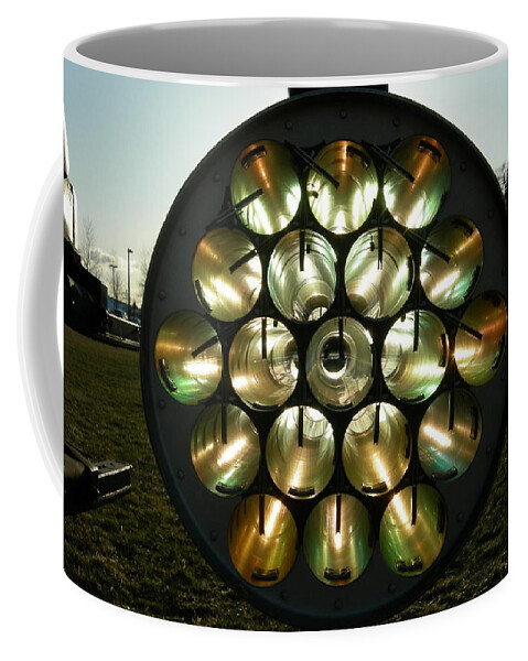 Helicopter Coffee Mug featuring the photograph Sun through rocket launcher by Jean Evans