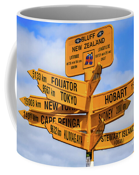 Signpost Coffee Mug featuring the photograph The end of the road - signpost at Stirling Point, Bluff, New Zealand by Lyl Dil Creations