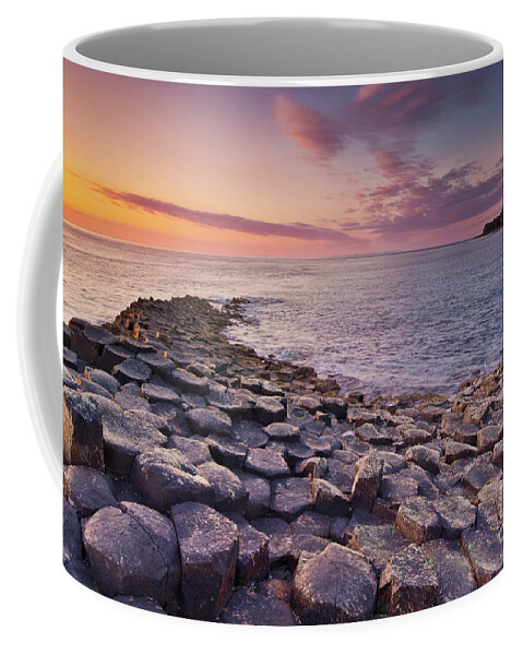 Giants Causeway Coffee Mug featuring the photograph The Giants Causeway sunset, Northern Ireland by Neale And Judith Clark