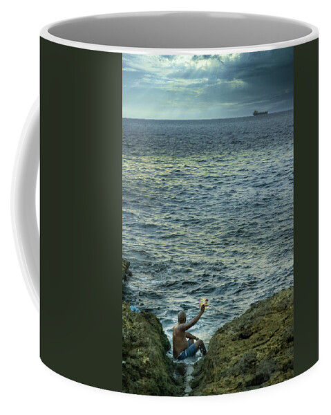 Storyteller Coffee Mug featuring the photograph The man who tells stories to the fishes by Micah Offman