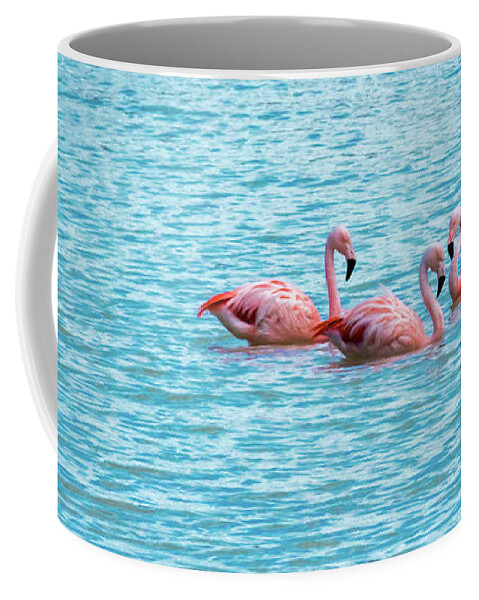 Flamingo Coffee Mug featuring the photograph Three flamingos on the Laguna Amarga by Lyl Dil Creations