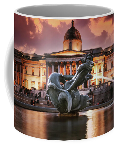 Trafalgar Square Coffee Mug featuring the photograph Trafalgar Square and the National Gallery in London illuminated by Karel Miragaya