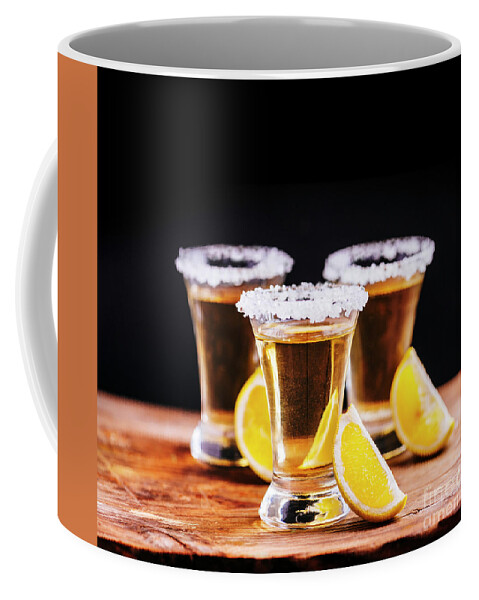 Tequila Coffee Mug featuring the photograph Tree shot glasses of Mexican tequila cocktail with lemon slices by Jelena Jovanovic