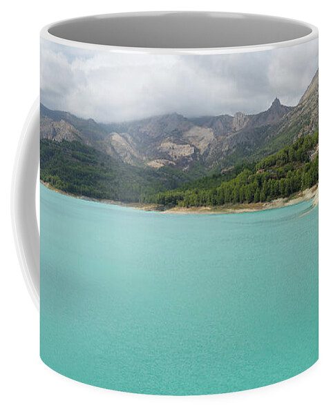 Guadalest Coffee Mug featuring the photograph Turquoise blue water and mountain landscape by Adriana Mueller