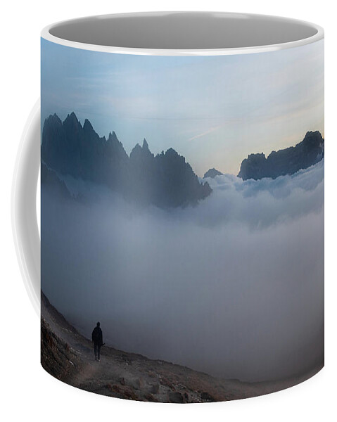 Italian Alps Coffee Mug featuring the photograph Unrecognized man trekking at the hiking path at Tre Cime in South Tyrol in Italy. by Michalakis Ppalis
