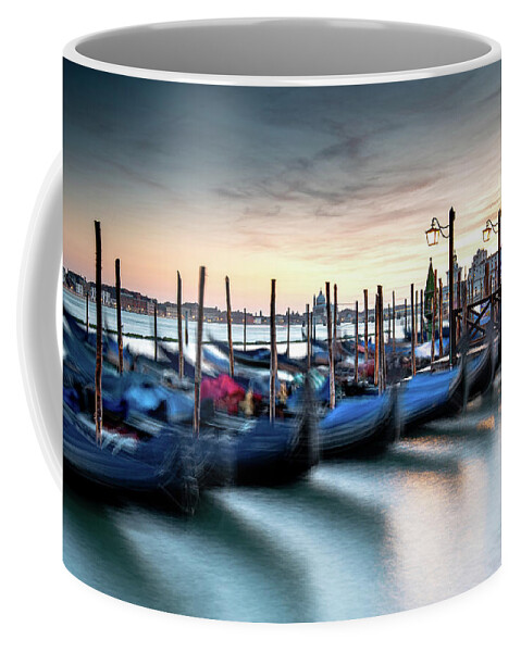 Gondola Coffee Mug featuring the photograph Venice Gondolas moored at the San Marco square. by Michalakis Ppalis