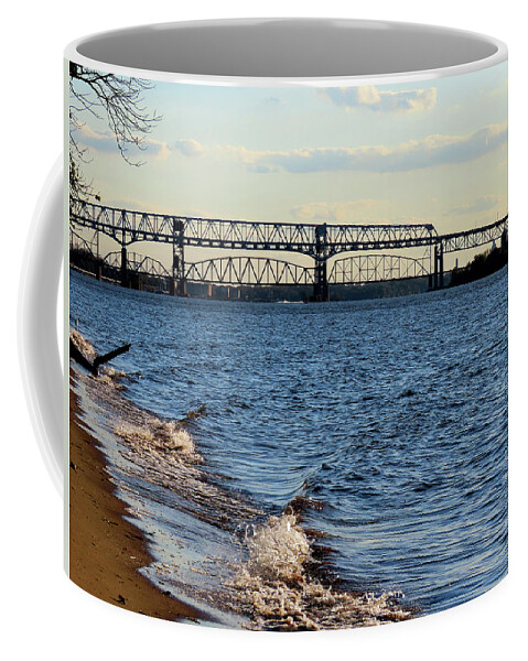 River Coffee Mug featuring the photograph Waves Lapping the Shore of the Delaware River Near Betsy Ross and Delair Memorial Railroad Bridges by Linda Stern