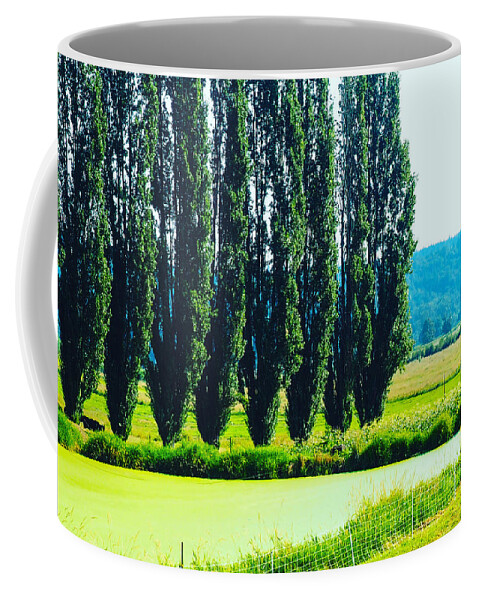 Green Coffee Mug featuring the photograph Wind Break by Grey Coopre
