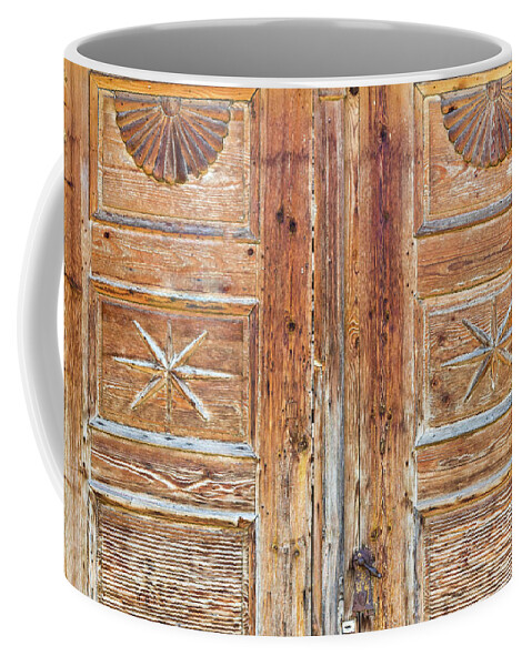 Brown Coffee Mug featuring the photograph Patterns on wooden door by Viktor Wallon-Hars