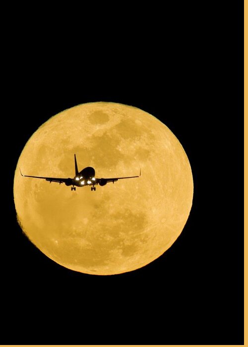 Moon Greeting Card featuring the photograph Aeroplane Silhouetted Against A Full Moon by David Nunuk
