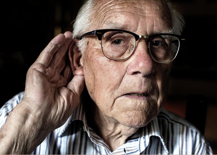 Human Greeting Card featuring the photograph Elderly Man With Hearing Loss #1 by Mauro Fermariello
