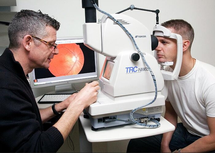 Equipment Greeting Card featuring the photograph Eye Examination #1 by Mark Thomas/science Photo Library