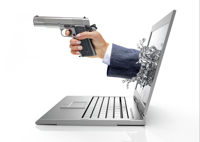 Artwork Greeting Card featuring the photograph Laptop With Hand And Gun #1 by Leonello Calvetti