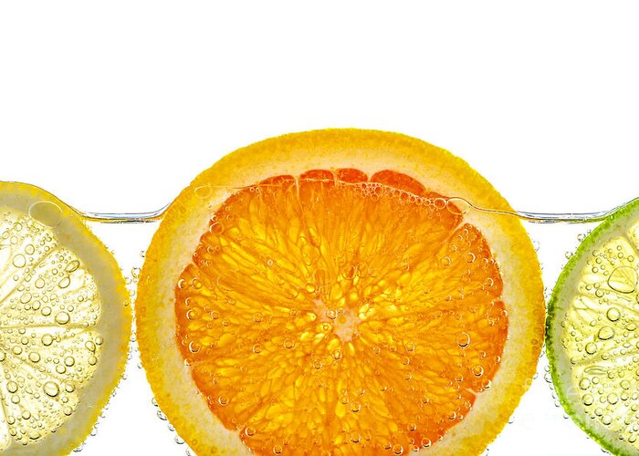 Orange Greeting Card featuring the photograph Orange lemon and lime slices in water 1 by Elena Elisseeva