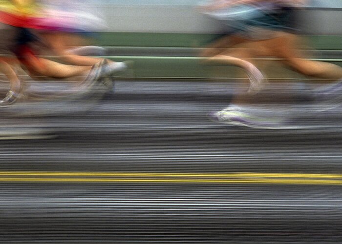 Action Greeting Card featuring the photograph Runners Blurred #1 by Jim Corwin