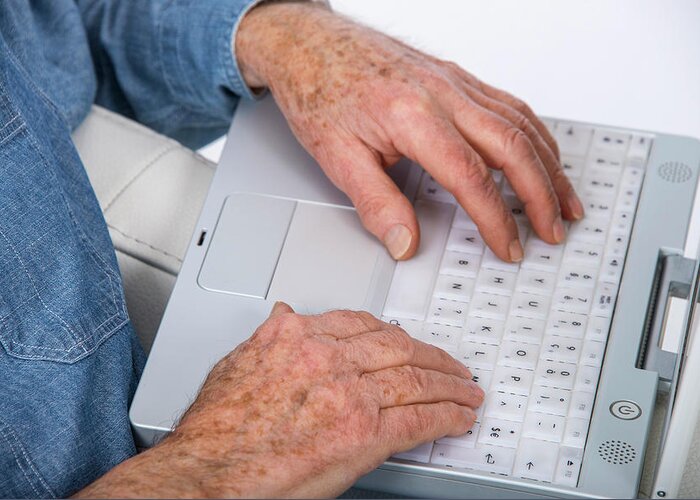 One Person Greeting Card featuring the photograph Senior Man Using Laptop #1 by Lea Paterson/science Photo Library