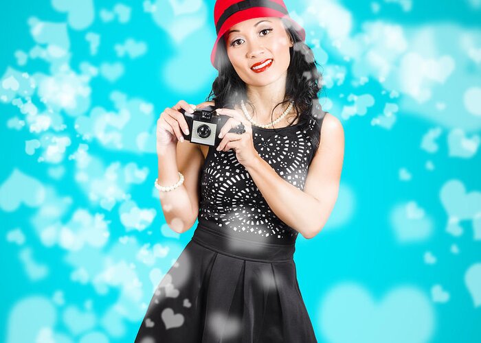 Camera Greeting Card featuring the photograph Young woman holding retro camera on blue #1 by Jorgo Photography