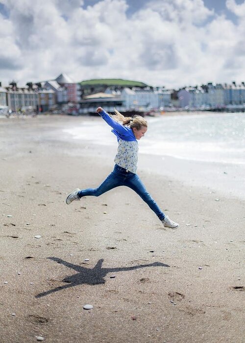 Outdoors Greeting Card featuring the photograph Girl Leaping On Beach #2 by Samuel Ashfield