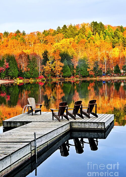 Lake Greeting Card featuring the photograph Wooden dock on autumn lake by Elena Elisseeva