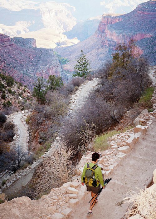 Non-urban Scene Greeting Card featuring the photograph A Female Hiker As She Walks by Ron Koeberer
