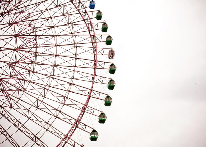Osaka Prefecture Greeting Card featuring the photograph A Large Ferris Wheel On A Cloudy Day by Adam Hester