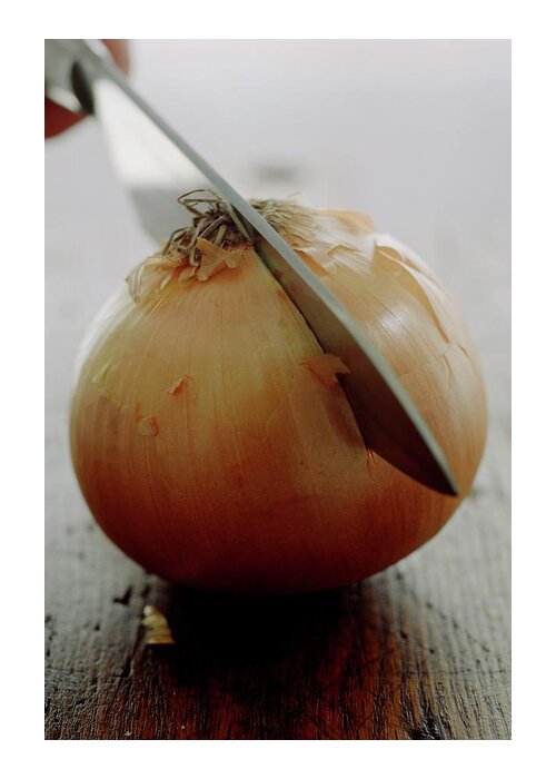 Fruits Greeting Card featuring the photograph A Raw Onion Being Cut In Half by Romulo Yanes