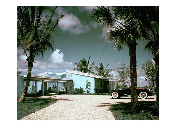 Nobodyoutdoorsdaytimehousedwellingdrivewayretroold-fashionedvintagevintage Cartransportationcarmotor Vehicleautomobilevehicletreemiamimiami-dade Countyfloridausanorth Americasouthern United Statesnorth American Atlantic Coastrobert M. Littlearchitecture #condenasthouse&gardenphotograph November 1st 1955 Greeting Card featuring the photograph A Vintage Car Parked Outside A Blue House by Tom Leonard