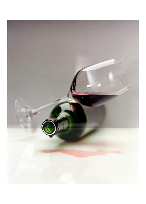 Beverage Greeting Card featuring the photograph A Wine Bottle And A Glass Of Wine by Romulo Yanes