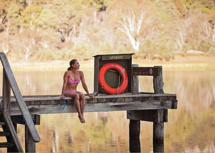 35-39 Years Greeting Card featuring the photograph A Woman Is Sitting By A Lake, Mount by Andrew Peacock