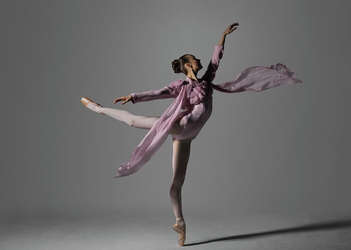 Ballet Dancer Greeting Card featuring the photograph Ballerina Performing Arabesque On Pointe by Nisian Hughes