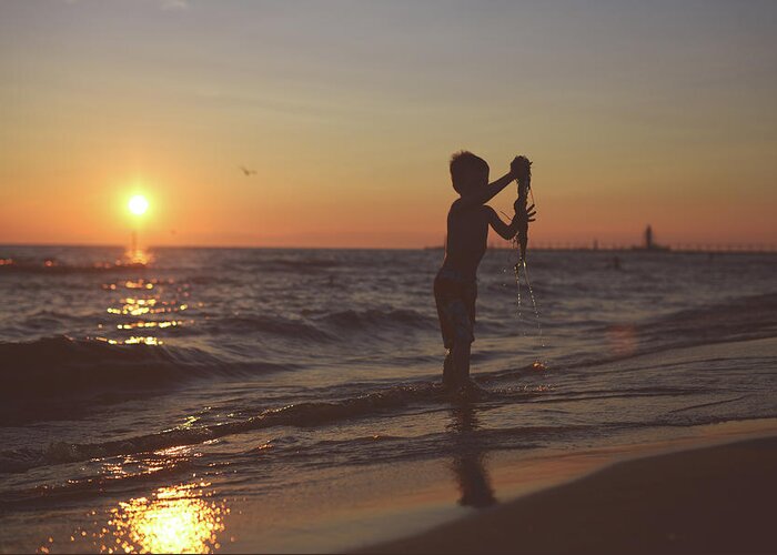Grand Haven Greeting Card featuring the photograph Boy On Beach by Jordan Parks Photography