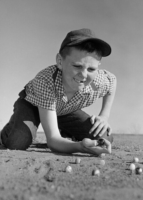 1950s Greeting Card featuring the photograph Boy Shooting Marbles, C.1950-60s by B. Taylor/ClassicStock