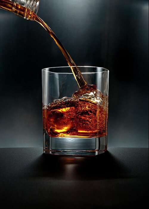 Alcohol Greeting Card featuring the photograph Brown Liquor Drink Pour On Black by Chris Stein