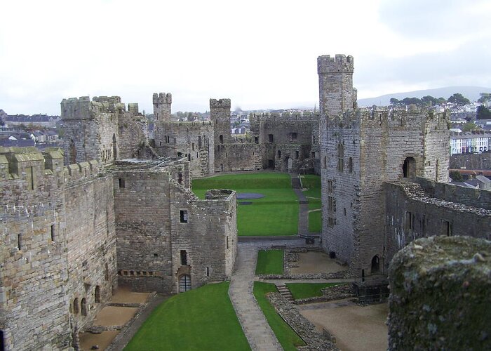 Castles Greeting Card featuring the photograph Caernarfon castle by Christopher Rowlands